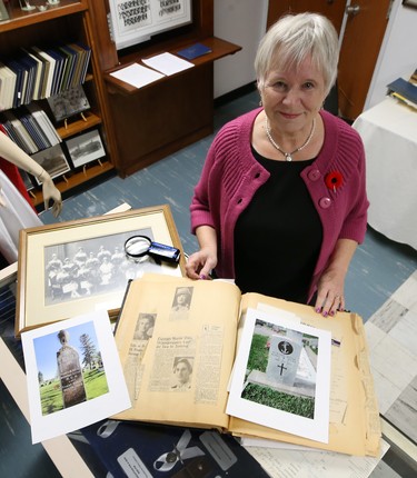 Dr. Barbara Paterson, chair of a committee which oversees the Misericordia Heritage Collection, poses with pictures and artifacts of war hero Agnes Wilkie of Carman, Man., the only nurse killed by enemy action in the Second World War, at the Misericordia Education & Research Centre in Winnipeg, on Wed., Nov. 7, 2018. Kevin King/Winnipeg Sun/Postmedia Network
