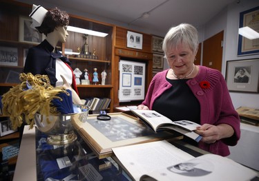 Dr. Barbara Paterson, chair of a committee which oversees the Misericordia Heritage Collection, thumbs through an artifact of war hero Agnes Wilkie of Carman, Man., the only nurse killed by enemy action in the Second World War, at the Misericordia Education & Research Centre in Winnipeg, on Wed., Nov. 7, 2018. Kevin King/Winnipeg Sun/Postmedia Network