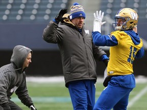 With coaches acting as pass-rushers, Matt Nichols prepares to release a pass during Winnipeg Blue Bombers practice on Wed., Nov. 14, 2018. Kevin King/Winnipeg Sun/Postmedia Network