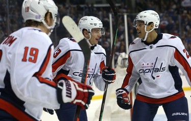 Washington Capitals forward Jakub Vrana (centre) celebrates his goal against the Winnipeg Jets in Winnipeg with Nicklas Backstrom (left) and Madison Bowey on Wed., Nov. 14, 2018. Kevin King/Winnipeg Sun/Postmedia Network