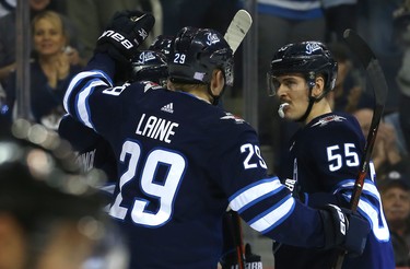 Winnipeg Jets centre Mark Scheifele (right) celebrates his power-play goal against the Washington Capitals in Winnipeg with Patrik Laine on Wed., Nov. 14, 2018. Kevin King/Winnipeg Sun/Postmedia Network