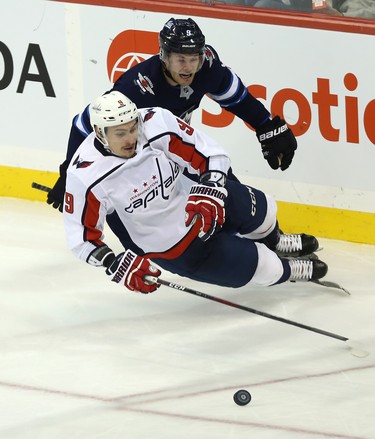 Winnipeg Jets forward Andrew Copp (top) is called for tripping Washington Capitals defenceman Dmitry Orlov in Winnipeg on Wed., Nov. 14, 2018. Kevin King/Winnipeg Sun/Postmedia Network