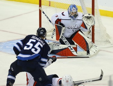 Washington Capitals goaltender Pheonix Copley eyes a shot from Winnipeg Jets centre Mark Scheifele in Winnipeg on Wed., Nov. 14, 2018. Kevin King/Winnipeg Sun/Postmedia Network