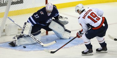 Winnipeg Jets goaltender Connor Hellebuyck stops  Washington Capitals centre Nicklas Backstrom on a breakaway in Winnipeg on Wed., Nov. 14, 2018. Kevin King/Winnipeg Sun/Postmedia Network