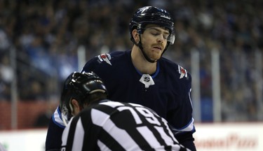 Winnipeg Jets centre Adam Lowry reacts after being kicked out of the faceoff circle against the Washington Capitals in Winnipeg on Wed., Nov. 14, 2018. Kevin King/Winnipeg Sun/Postmedia Network