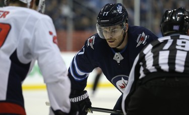 Winnipeg Jets centre Adam Lowry lines up against the Washington Capitals centre Lars Eller in Winnipeg on Wed., Nov. 14, 2018. Kevin King/Winnipeg Sun/Postmedia Network