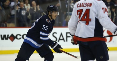 Winnipeg Jets centre Mark Scheifele heads to the bench to celebrate his power-play goal against the Washington Capitals in Winnipeg on Wed., Nov. 14, 2018. Kevin King/Winnipeg Sun/Postmedia Network