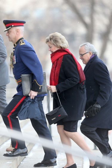 Janice Clare Filmon (middle), the 25th and current Lieutenant Governor of Manitoba, arrives at the Manitoba Legislative Building, in Winnipeg,  to deliver the Throne Speech.  She is accompanied by her husband, former Manitoba Premier, Gary Filmon (right), and a Winnipeg Police Service member. Tuesday, November 20/2018 Winnipeg Sun/Chris Procaylo/stf