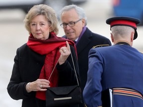 Manitoba Lieutenant-Governor Janice Filmon (left), arrives at the Manitoba Legislative Building, in Winnipeg, to deliver the Throne Speech on Tuesday, Nov. 20, 2018. She is accompanied by her husband, former Manitoba Premier, Gary Filmon. Filmon underwent surgery for breast cancer on Monday, and as a result will be unable to perform her duties as lieutenant-governor for a period of time.