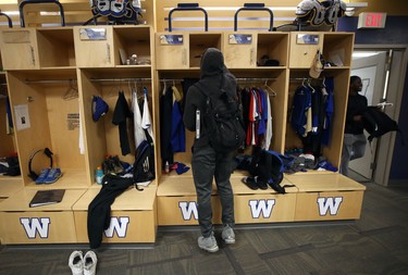 Chandler Fenner sorts through his locker in the Winnipeg Blue Bombers dressing room on Mon., Nov. 19, 2018. Kevin King/Winnipeg Sun/Postmedia Network
