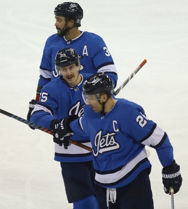 Winnipeg Jets centre Mark Scheifele (centre) celebrates his second goal of the game against the Pittsburgh Penguins with Blake Wheeler (bottom) and Dustin Byfuglien in Winnipeg on Tues., Nov. 27, 2018. Kevin King/Winnipeg Sun/Postmedia Network