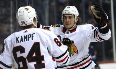 Chicago Blackhawks forward John Hayden (right) celebrates his goal against the Winnipeg Jets in Winnipeg on Thurs., Nov. 29, 2018 with centre David Kampf. Kevin King/Winnipeg Sun/Postmedia Network