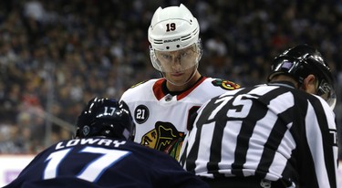 Chicago Blackhawks centre Jonathan Toews enters the face-off circle against Winnipeg Jets centre Adam Lowry in Winnipeg on Thurs., Nov. 29, 2018. Kevin King/Winnipeg Sun/Postmedia Network