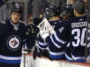 Winnipeg Jets forward Patrik Laine celebrates his 100th career goal, against the Chicago Blackhawks in Winnipeg, on Thurs., Nov. 29, 2018. Kevin King/Winnipeg Sun/Postmedia Network