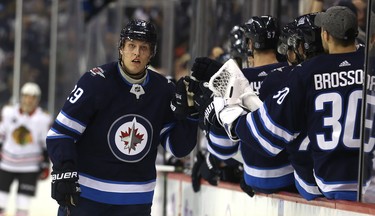 Winnipeg Jets forward Patrik Laine celebrates his 100th career goal, against the Chicago Blackhawks in Winnipeg, on Thurs., Nov. 29, 2018. Kevin King/Winnipeg Sun/Postmedia Network