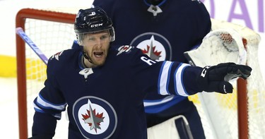 Winnipeg Jets defenceman Cam Schilling directs traffic against the Chicago Blackhawks in Winnipeg on Thurs., Nov. 29, 2018. Kevin King/Winnipeg Sun/Postmedia Network