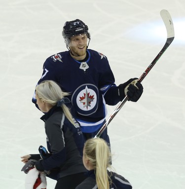 Ice crew picks up hats as Winnipeg Jets forward Nikolaj Ehlers celebrates his third goal of the night against the Chicago Blackhawks in Winnipeg on Thurs., Nov. 29, 2018. Kevin King/Winnipeg Sun/Postmedia Network