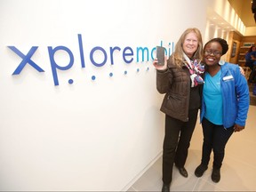 Xplore Mobile Sales Associate Thinky Grace Ndlovu, on Wednesday, Nov. 14, 2018, welcomes Dana Daman as the first new customer on Xplore MobileÕs network at its store in the St. Vital Centre in Winnipeg.
Handout