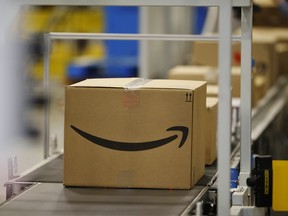 This May 3, 2018, photo shows boxes on a conveyor belt during a tour of the Amazon fulfillment center in Aurora, Colo. (AP Photo/David Zalubowski)