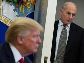In this file photo taken on February 02, 2018, White House Chief of Staff John Kelly looks on as US President Donald Trump meets with North Korean defectors in the Oval Office at the White House in Washington, DC. -