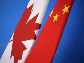 Flags of Canada and China are placed for the first China-Canada economic and financial strategy dialogue in Beijing, China, Monday, Nov. 12, 2018. Experts say the detaining of an Alberta woman over what authorities call employment issues could signal a ramping up of low-level harassment for Canadians living in China. THE CANADIAN PRESS/AP-Jason Lee/Pool Photo via AP ORG XMIT: CPT132