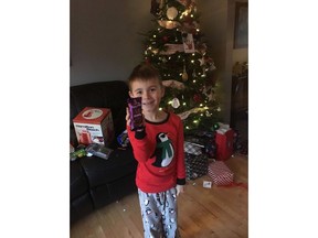 Santa's helpers came through this year for a little boy who only wanted one thing for Christmas: a chocolate bar that can't be found in North America. Isaac Comstock, 7, is shown in a handout photo holding a Cadbury Dairy Milk Silk Bubbly bar, which is only available in India and South Africa.