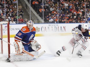 Winnipeg Jets' Brendan Lemieux (48) is stopped by Edmonton Oilers' goalie Mikko Koskinen (19) during first period NHL action in Edmonton on Monday.