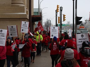 Protesters, more than 100 of them, gathered outside Winnipeg's Union Station on Wednesday as part of a national Unifor protest against Via Rail’s recent decisions to cut back on Western Transcontinental operations. Luke Rempel/Postmedia