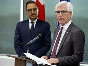 Minister of Natural Resources Amarjeet Sohi (left) and Minister of International Trade Diversification Jim Carr (right) take part in a press conference where the Federal government announced $1.6 billion in support for Canada's oil and gas sector, in Edmonton on Tuesday, Dec. 18, 2018.