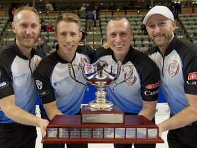 The team of (from left) skip Brad Jacobs, third Marc Kennedy, second E.J. Harnden, and lead Ryan Harnden hold the trophy after winning the Home Hardware Canada Cup in Estevan, Sask., on Dec. 9, 2018. (MICHAEL BURNS/Photo)