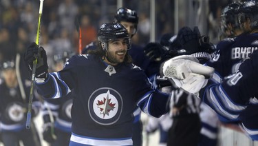 Winnipeg Jets forward Mathieu Perreault celebrates his power-play goal against the Tampa Bay Lightning in Winnipeg on Sun., Dec. 16, 2018. Kevin King/Winnipeg Sun/Postmedia Network