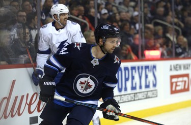 Winnipeg Jets defenceman Josh Morrissey (right) reacts as Tampa Bay Lightning forward Alex Killorn celebrates his first-period goal in Winnipeg on Sun., Dec. 16, 2018. Kevin King/Winnipeg Sun/Postmedia Network