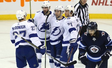 Tampa Bay Lightning centre Tyler Johnson (centre) celebrates his second-period goal against the Winnipeg Jets  in Winnipeg with Ryan McDonagh, Nikita Kucherov and Brayden Point (from left) on Sun., Dec. 16, 2018. Kevin King/Winnipeg Sun/Postmedia Network