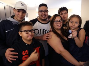 The Beaulieu family Ñ from left, Jordan, 15, Eric, 12, Craig, Leann, Quinton, 14, and Tierra, 7 Ñ are pictured in their new Habitat for Humanity home on Flora Avenue in Winnipeg on Wed., Dec. 19, 2018. The family will move in on Friday. Kevin King/Winnipeg Sun/Postmedia Network