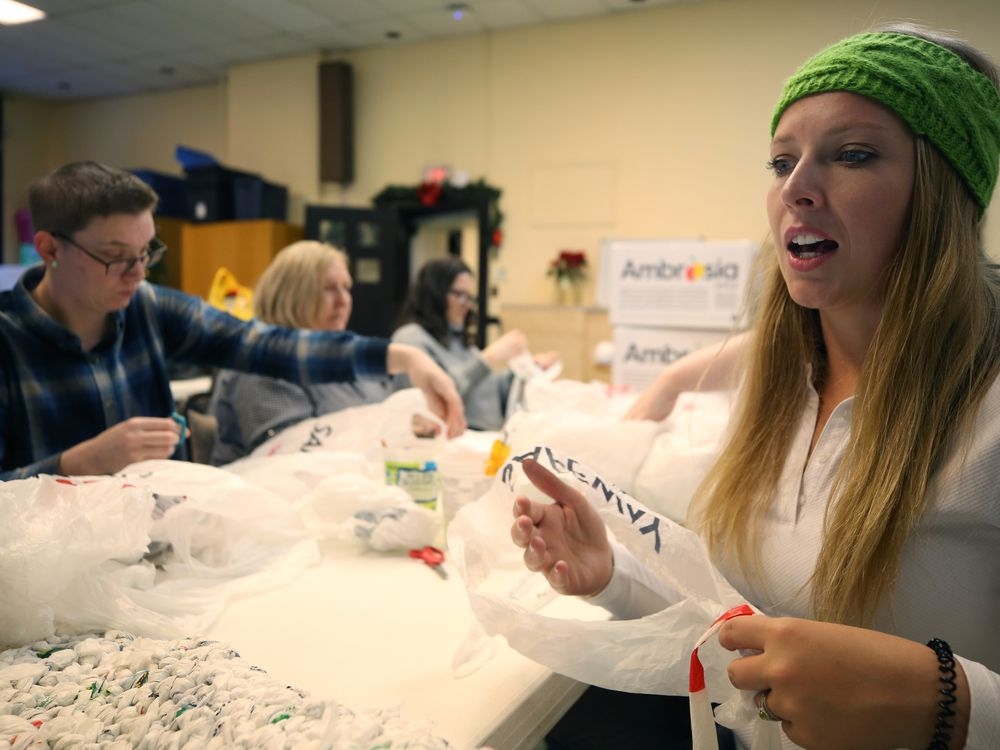'LABOUR OF LOVE' Volunteers pitch in to turn plastic bags into mats