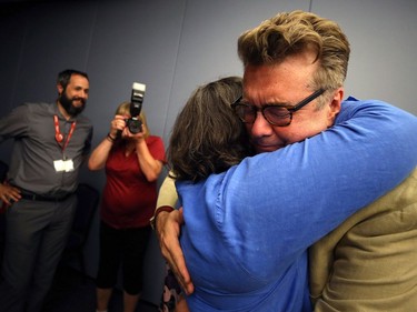 Liberal leader Dougald Lamont hugs a supporter at the Norwood Hotel in Winnipeg after winning the St. Boniface by-election on Tues., July 17, 2018. Kevin King/Winnipeg Sun/Postmedia Network