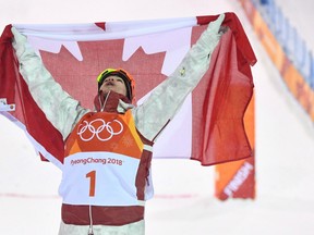 Canadian Mikael Kingsbury celebrates after winning the men's moguls at the 2018 Winter Olympic Games at Phoenix Snow Park in Pyeongchang, South Korea, Monday, Feb. 12, 2018. THE CANADIAN PRESS/Jonathan Hayward ORG XMIT: CPT508