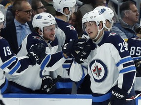 Winnipeg Jets' Patrik Laine (29), of Finland, is congratulated by Brendan Lemieux after scoring during the second period of an NHL hockey game against the St. Louis Blues, Saturday, Nov. 24, 2018, in St. Louis. (AP Photo/Jeff Roberson) ORG XMIT: MOJR112