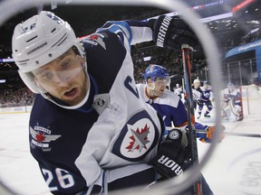 Jets' Blake Wheeler plays the puck against the New York Islanders during the third period at the Barclays Center on Dec. 4, 2018 in  Brooklyn. (GETTY IMAGES)