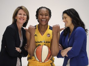 In this May 9, 2016, file photo, Indiana Fever's Tamika Catchings jokes with head coach Stephanie White, right, and Kelly Krauskopf, president and general manager, during WNBA basketball media day in Indianapolis. (AP Photo/Darron Cummings, File)