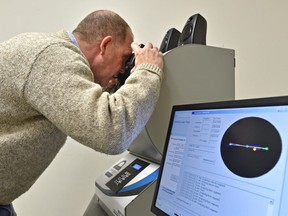 Randal Roberts demonstrates the MFP100 Impairment Screen, an eye scan for testing impairment, in Edmonton, December 11, 2018. Ed Kaiser/Postmedia