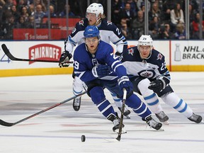 William Nylander of the Toronto Maple Leafs breaks past Paul Stastny of the Winnipeg Jets during an NHL game at the Air Canada Centre on March 31, 2018, in Toronto.