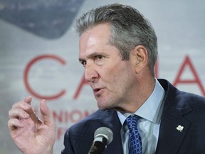 Manitoba Premier Brian Pallister responds to questions during a news conference at the first ministers meeting in Montreal on Friday, December 7, 2018. THE CANADIAN PRESS/Paul Chiasson