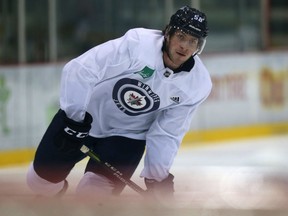 Forward Jansen Harkins shoots during Winnipeg Jets training camp in September. Harkins had the lone goal in a 2-1 loss to the San Diego Gulls on Friday.