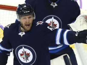 Winnipeg Jets defenceman Cam Schilling directs traffic against the Chicago Blackhawks in Winnipeg on Thurs., Nov. 29, 2018. Kevin King/Winnipeg Sun/Postmedia Network