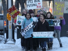 Students from a Winnipeg junior high school participated in a call for action on environmental issues Friday. These students marched to the Winnipeg office of MP Jim Carr,