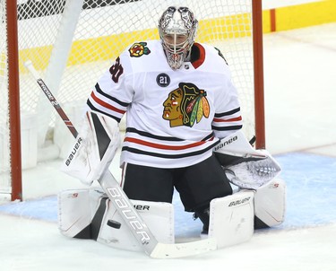 Chicago Blackhawks goaltender Cam Ward stops a shot from Winnipeg Jets forward Blake Wheeler in Winnipeg on Tues., Dec. 11, 2018. Kevin King/Winnipeg Sun/Postmedia Network