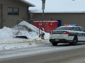 Police cruisers and tape at the scene where a body was found in the 1900 block of Logan Avenue at around 11:40 a.m., on Tuesday. Police were responding to check on the well-being of an individual when they found the body.