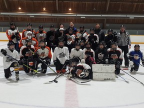 This year's Krawat Family Christmas Skate raised $946.25 for the Winnipeg Sun's Empty Stocking Fund and the Christmas Cheer Board. Organizer and founder Dr. Tony Krawat is the tall fellow in the centre of the rear row.