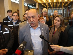 Amalgamated Transit Union Local 1505 president Aleem Chaudhary speaks to media on Tuesday. Chaudhary successfully called on council's public works committee to speed up a plan to install driver safety shields on Winnipeg Transit buses, which would require full council approval.